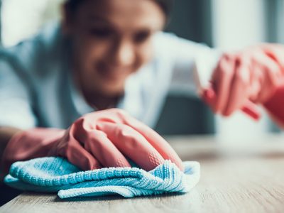 Young Smiling Woman in Gloves Cleaning House